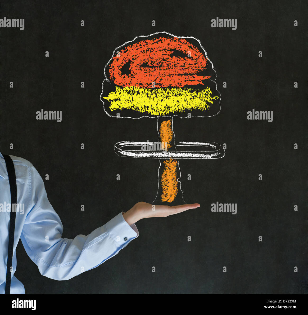 Business man, student, teacher or politician with chalk nuclear bomb cloud on hand blackboard background Stock Photo