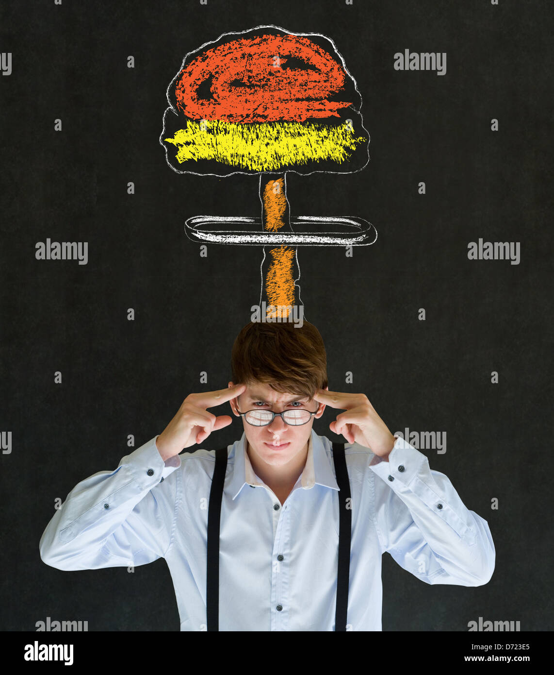 Business man, student or teacher with thought thinking chalk nuclear bomb cloud on blackboard background Stock Photo
