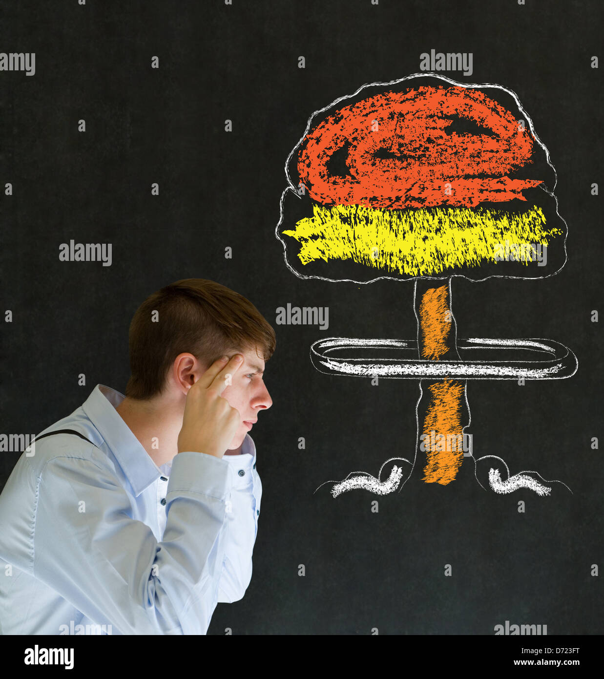 Business man, student or teacher with thought thinking chalk nuclear bomb cloud on blackboard background Stock Photo