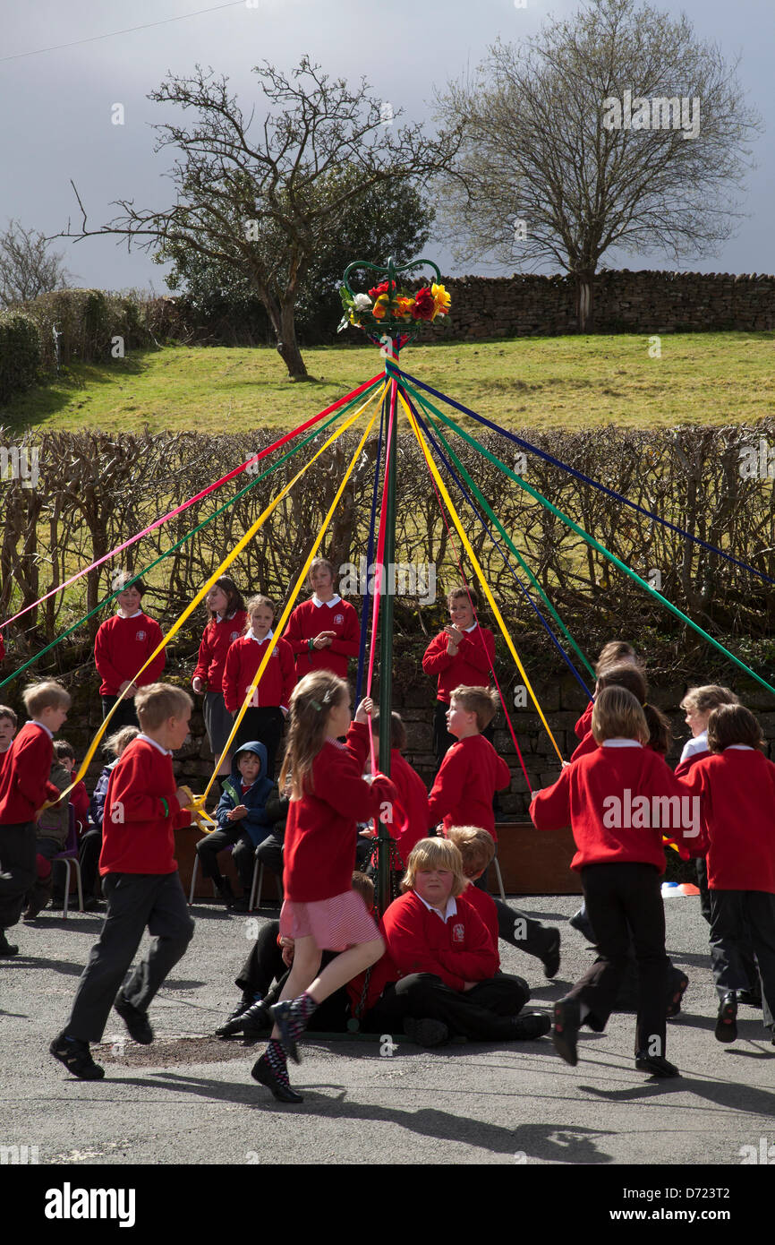 Mayday celebration activity, children dancing around a maypole in Wray ...