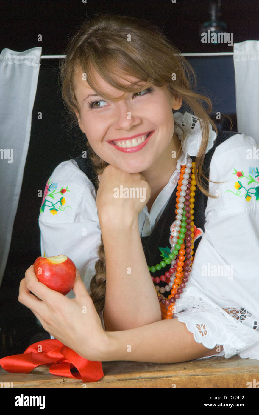 Young woman in Mazovia national costume, a Polish folk costume, smiling Stock Photo