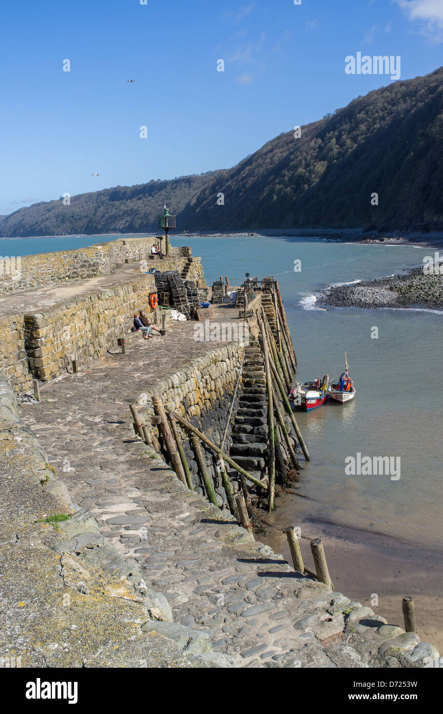 Clovelly, North Devon, England. The harbor harbour and coastline and cliffs. Stock Photo