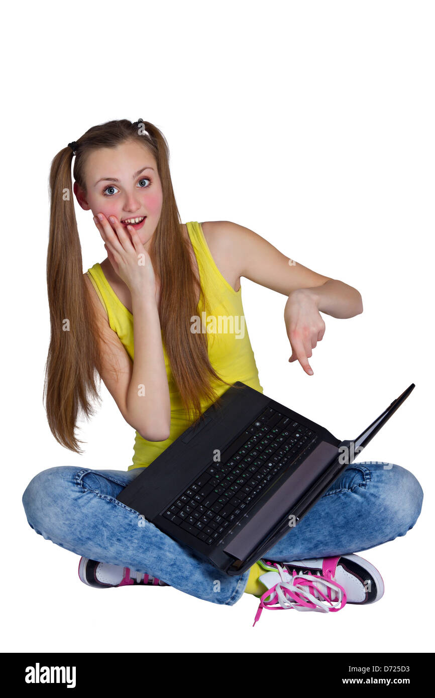 of beautiful young girl sitting on the floor and using laptop Stock ...