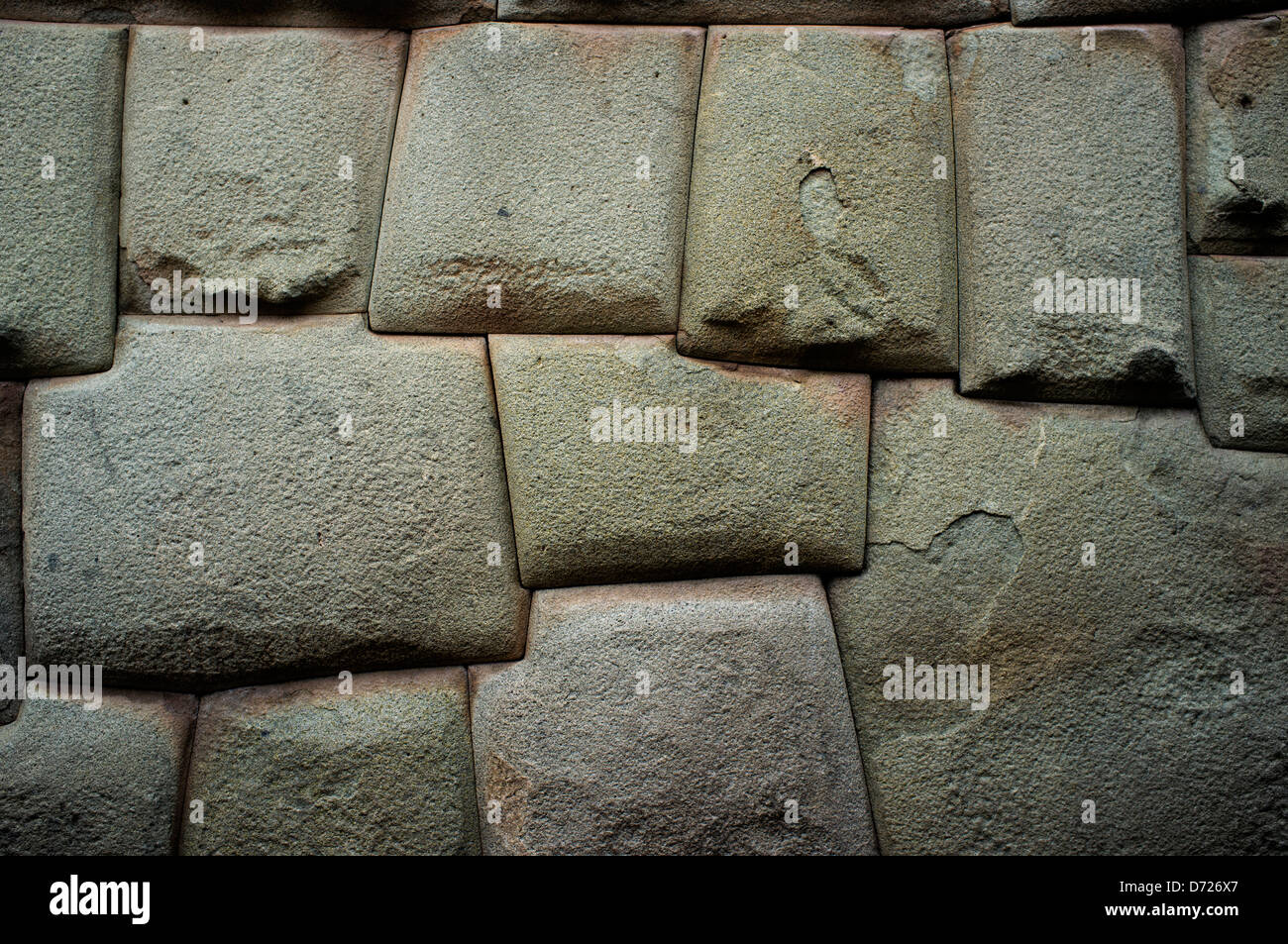 Ancient Incan stonework upon which newer buildings were constructed line many streets of central Cuzco, Peru. Stock Photo