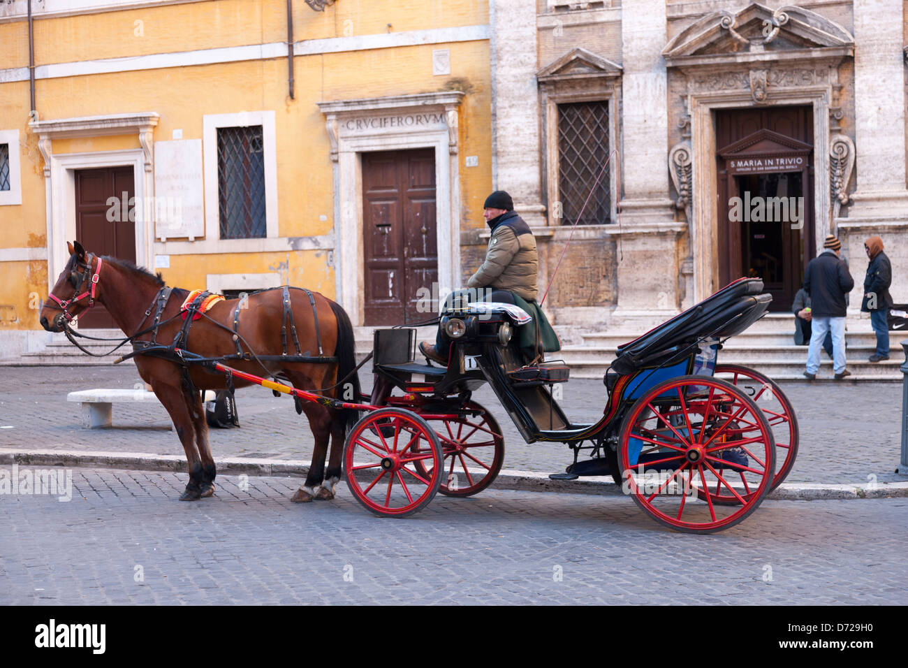 A horse and carriage outside the church of Santa Maria in Trivio, Rome, Italy Stock Photo