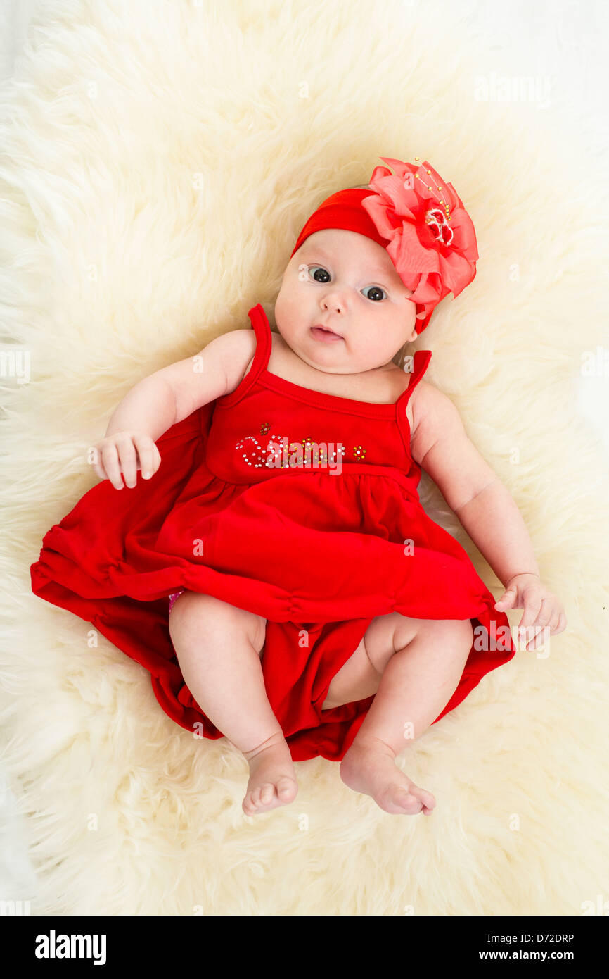 beautiful baby in red dress Stock Photo ...