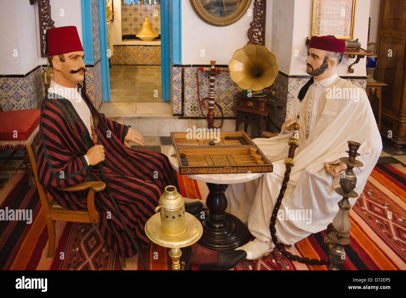 Model of Tunisian men smoking Shisha pipe in the museum, Sidi Bou Said, Tunis, Tunisia Stock Photo