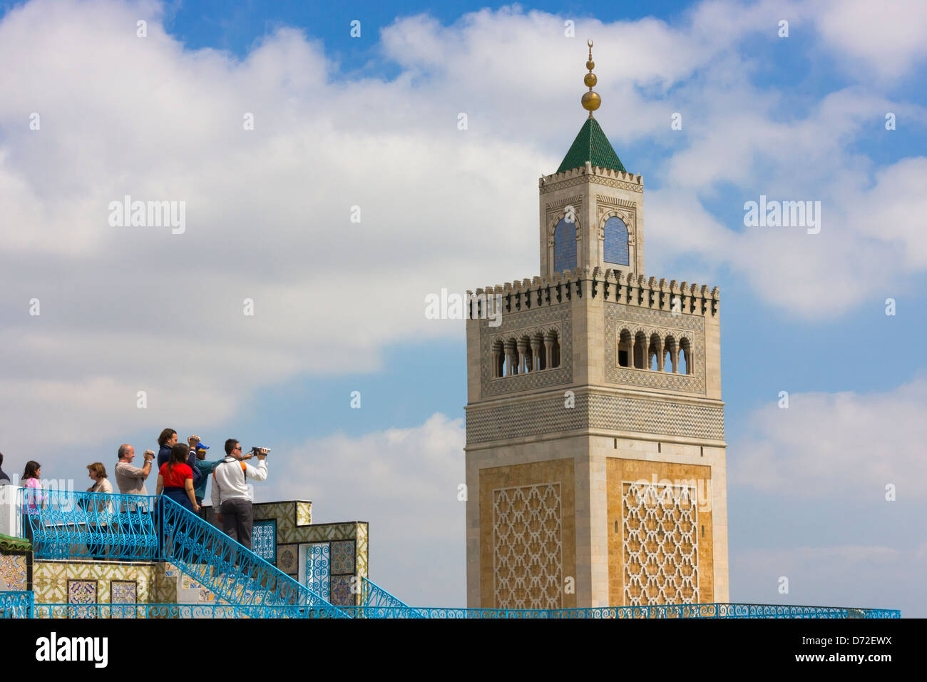 Tourists watching the Minaret of the Great Mosque, Sidi Bou Said, Tunis, Tunisia Stock Photo