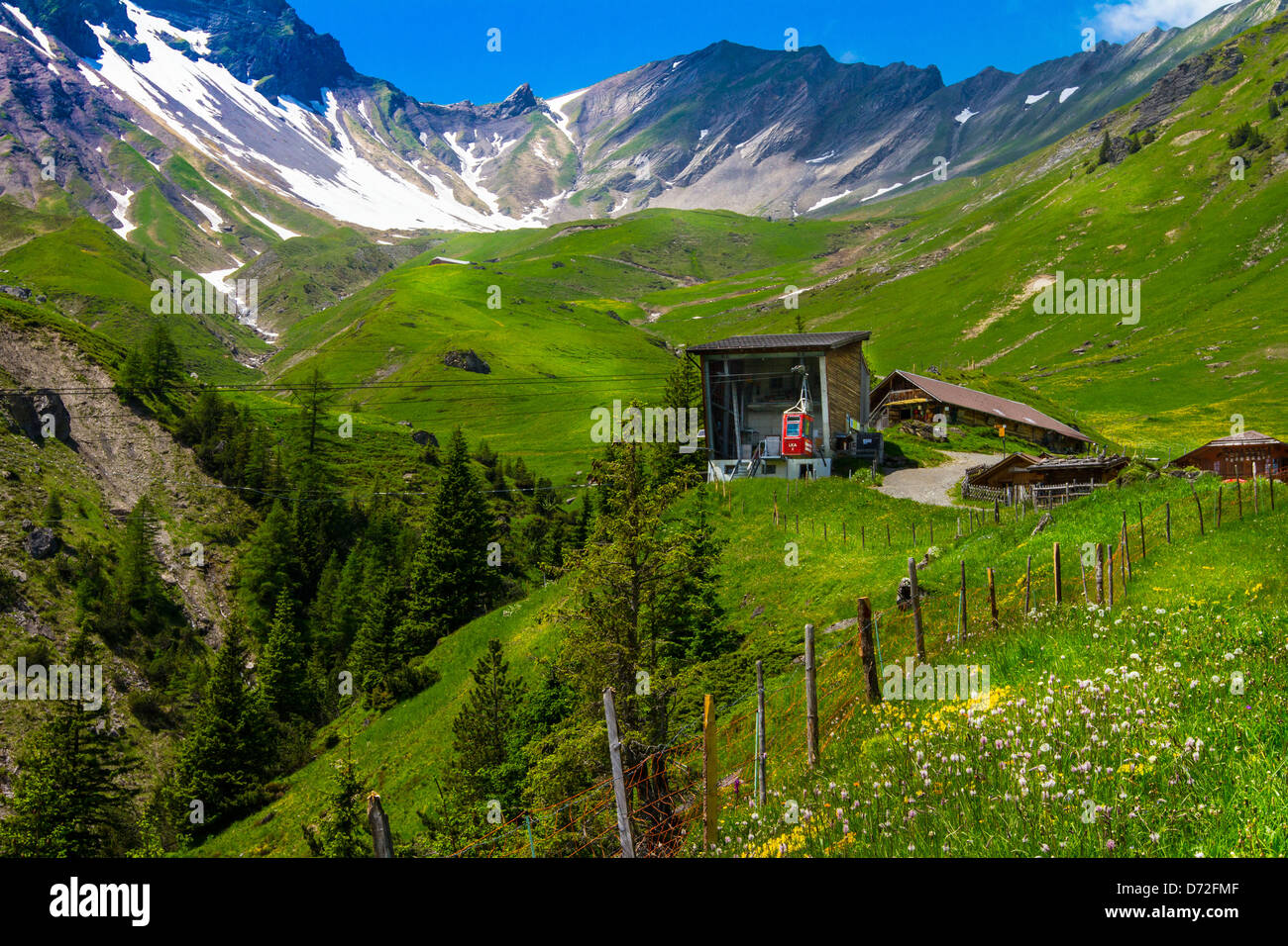 Allmenalp at Kandersteg, Switzerland. View of high mountain area and incoming cable car in the spring. Stock Photo