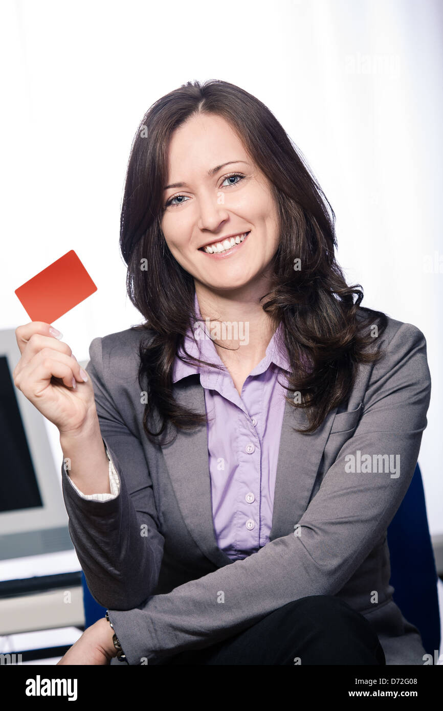 A young woman from bank with a bank card Stock Photo