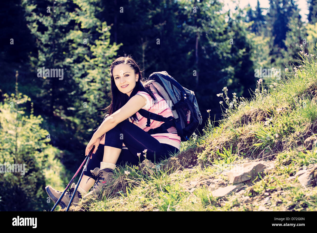 young woman hiking in the wild nature Stock Photo