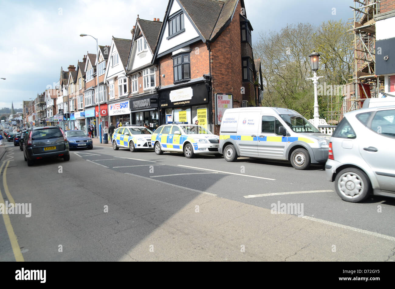 Tonbridge, Kent, UK. April 27th 2013: Witnesses have reported a suspected armed robbery at Thomson Travel Agents in Tonbridge, Kent. Police Officer on scene in Tonbridge High Street following suspected armed robbery. Police have not yet confirmed this. Credit: Duncan Penfold/Alamy Live News Stock Photo