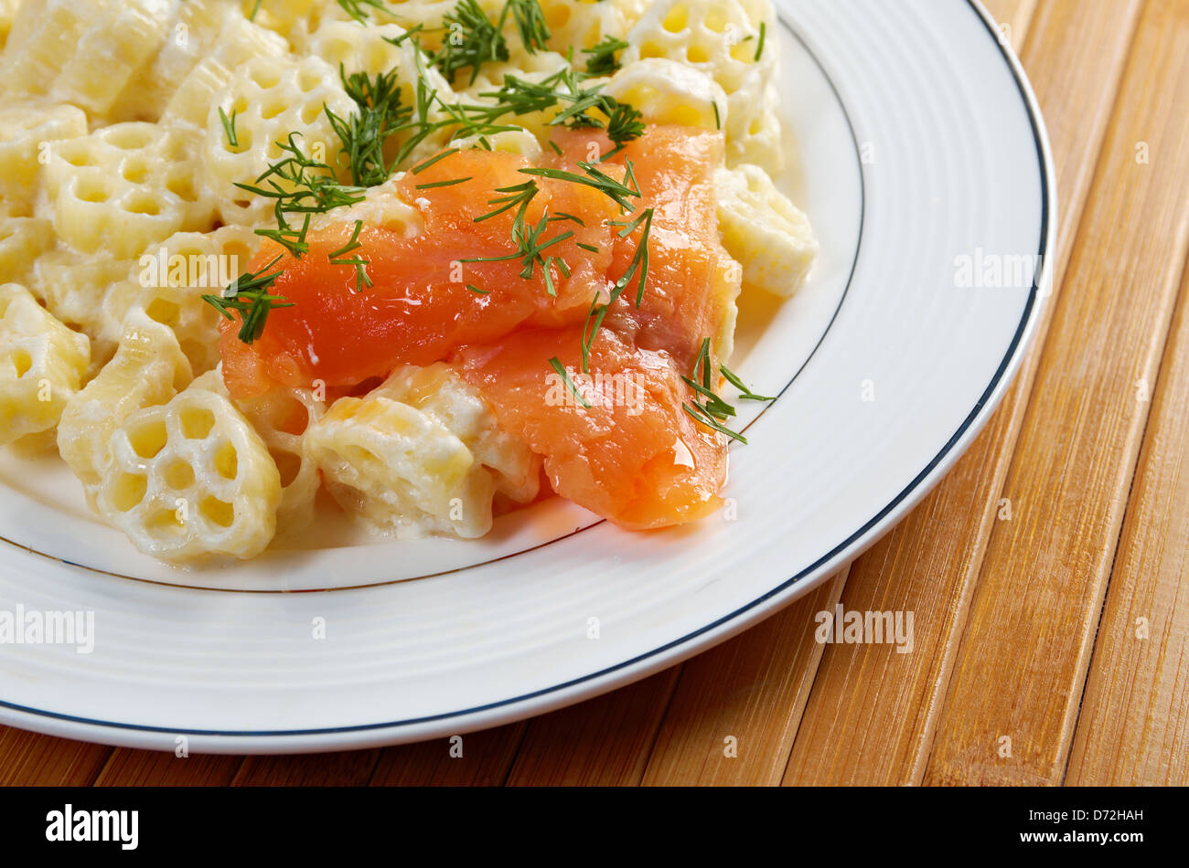 ruote pasta with cream sauce and salmon.closeup Stock Photo