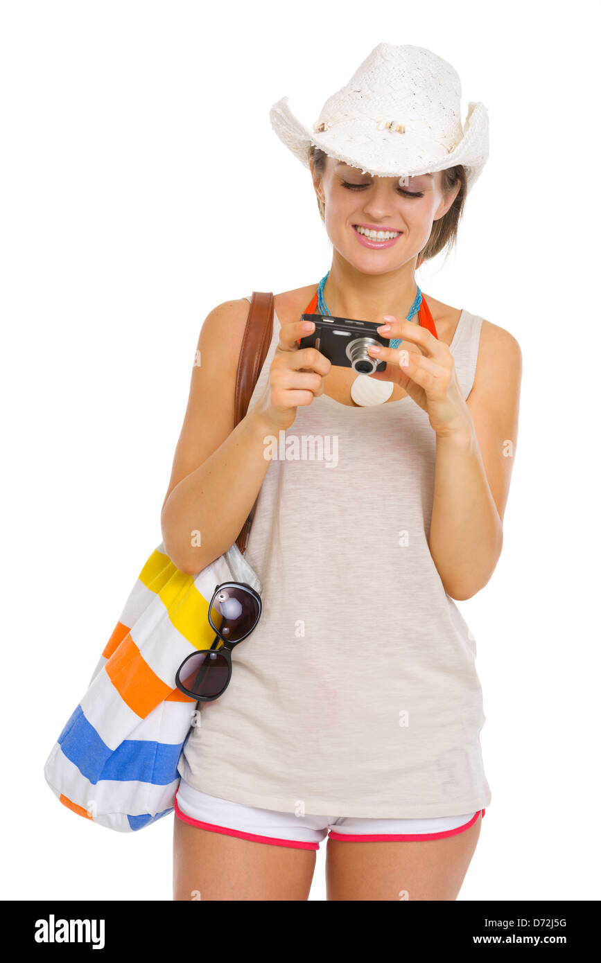 Happy beach young woman looking photos in camera Stock Photo - Alamy