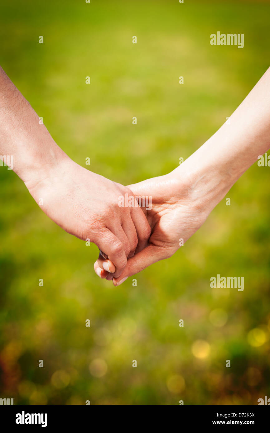 Close-up Holding Hands Stock Photo