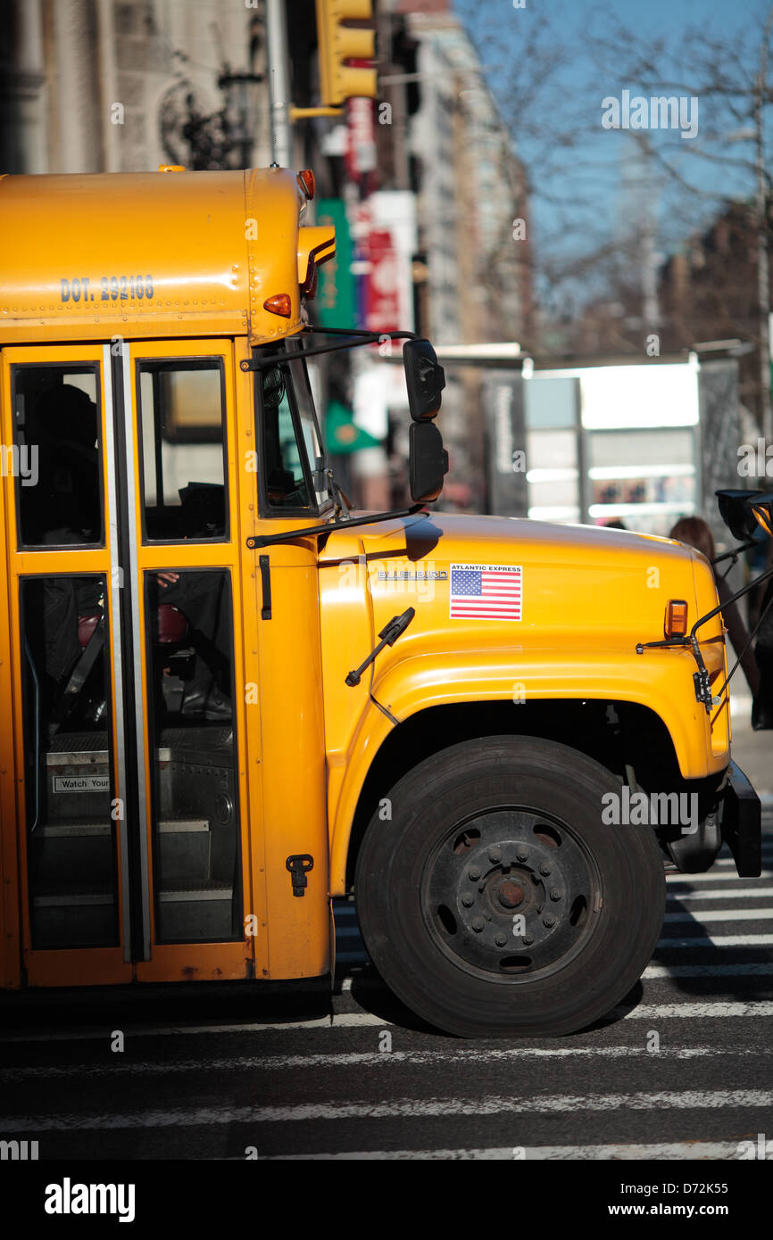 Yellow school bus in Manhattan, New York. Stock Photo