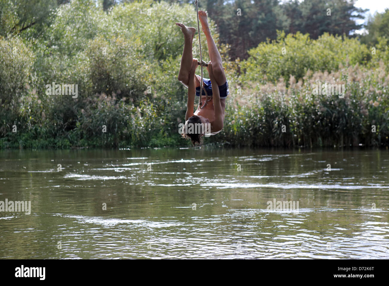 Man hanging upside down by a rope hi-res stock photography and images ...