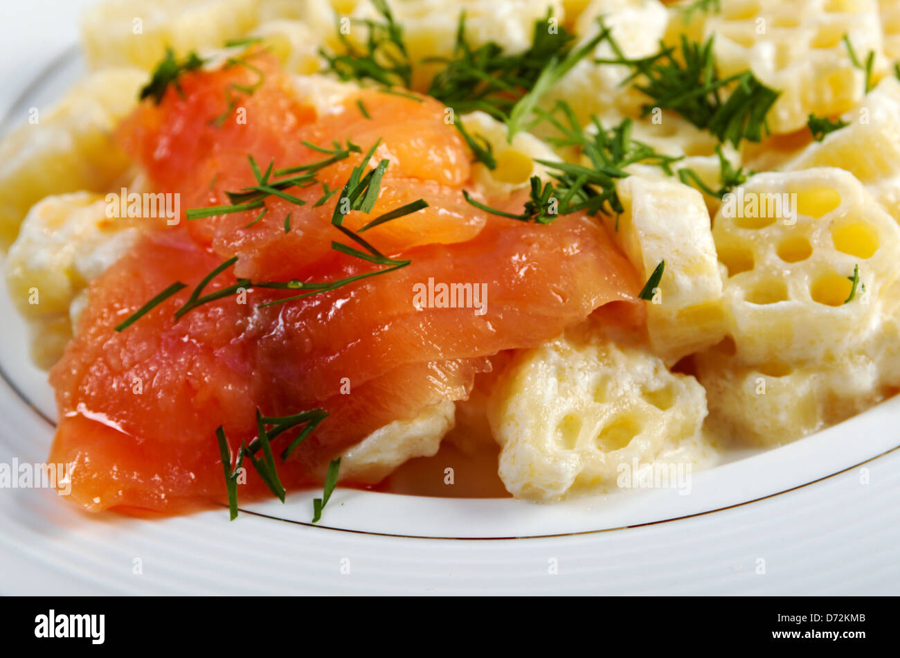 ruote pasta with cream sauce and salmon.closeup Stock Photo