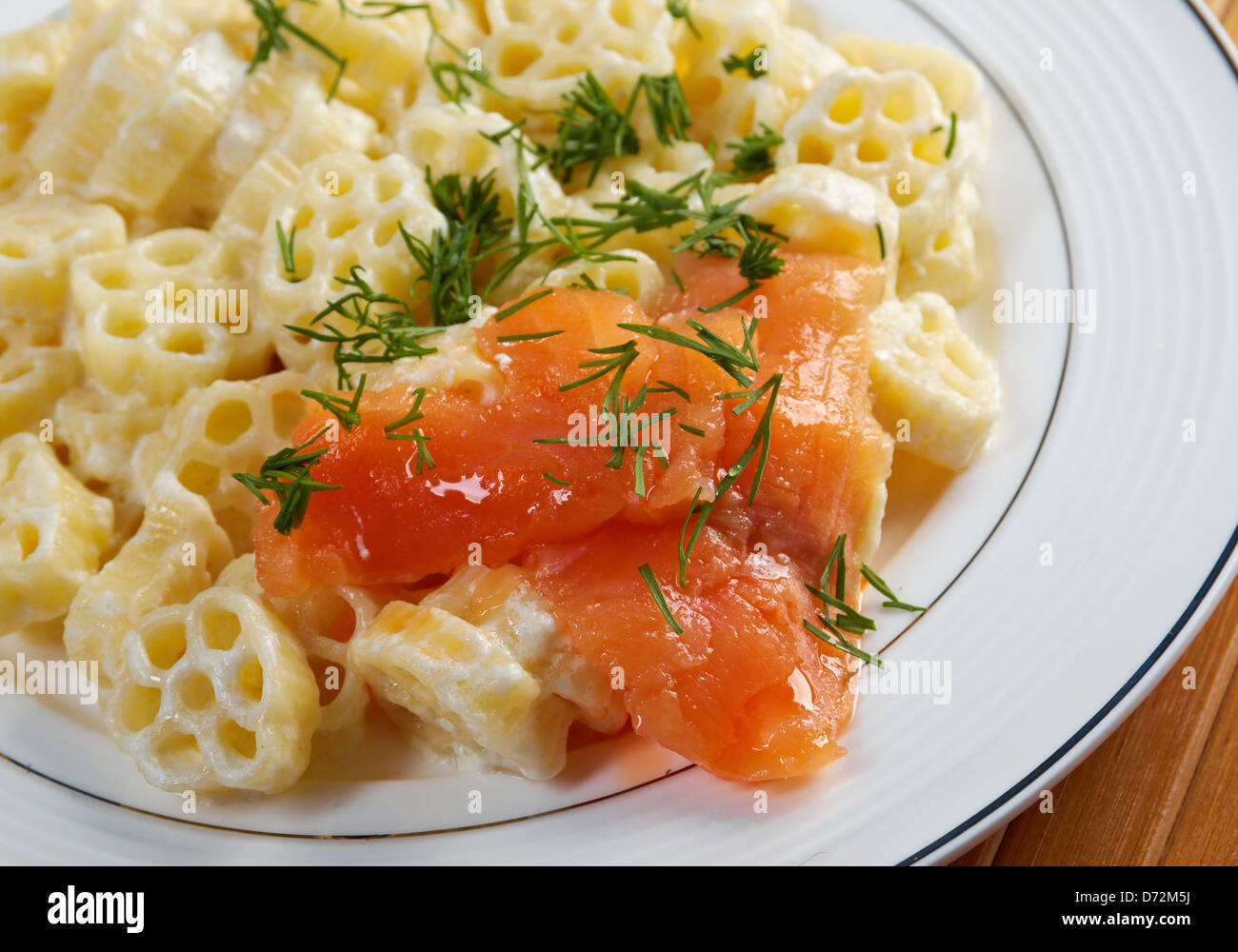 ruote pasta with cream sauce and salmon.closeup Stock Photo