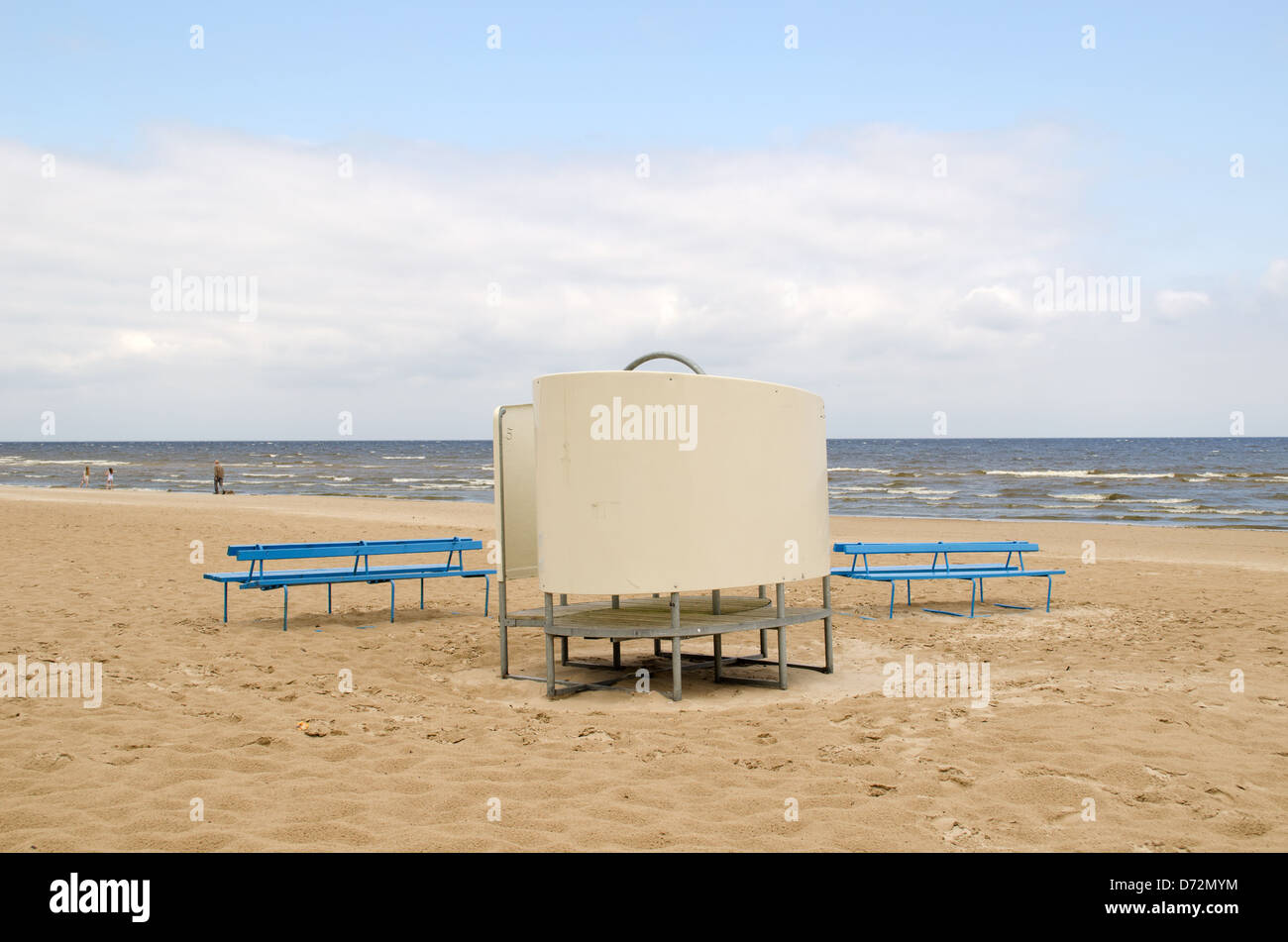 Two Blue Wooden Benches Near Wear Changing Cabin On Sea Ocean