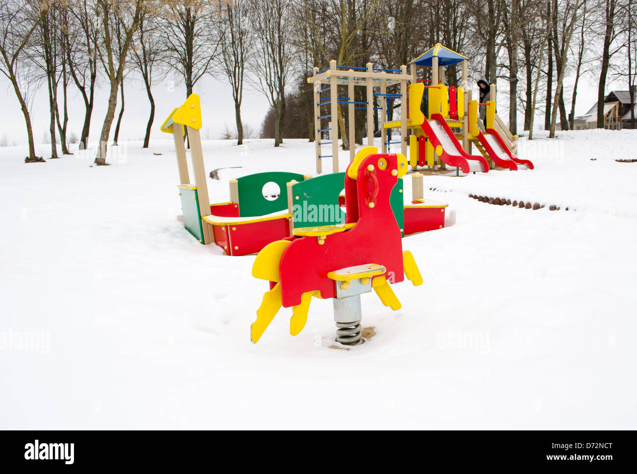 empty colorful playground surrounded by snow in winter Stock Photo - Alamy