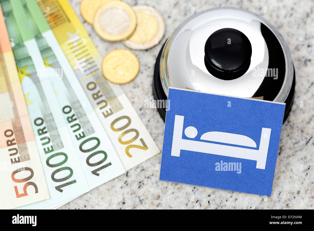 Bell and bank notes in an adoption, symbolic photo Bed-expensive Stock Photo