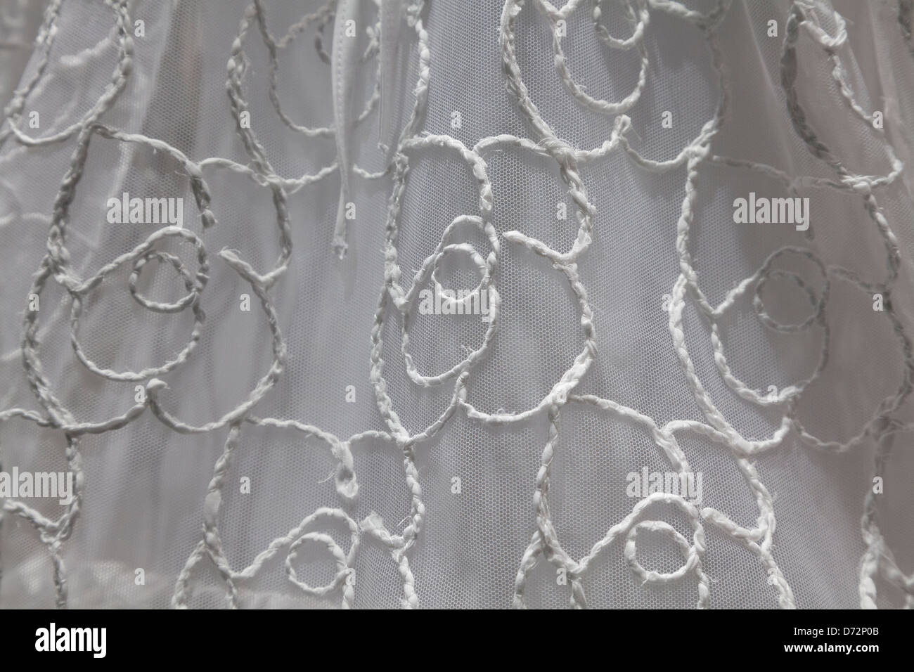 Close-up of hand-stitched wedding dress Stock Photo