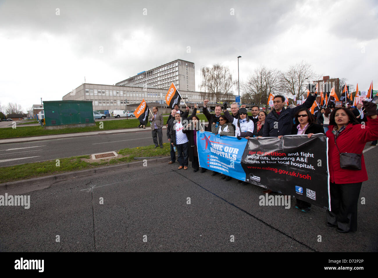 London, UK. 27th April 2013. Protesters walk past Ealing hospital, hundreds of people marched in West London in protest against the closing of A&E departments at Charing Cross, Hammersmith, Central Middlesex and Ealing Hospitals.Credit:Sebastian Remme/Alamy Live News Stock Photo