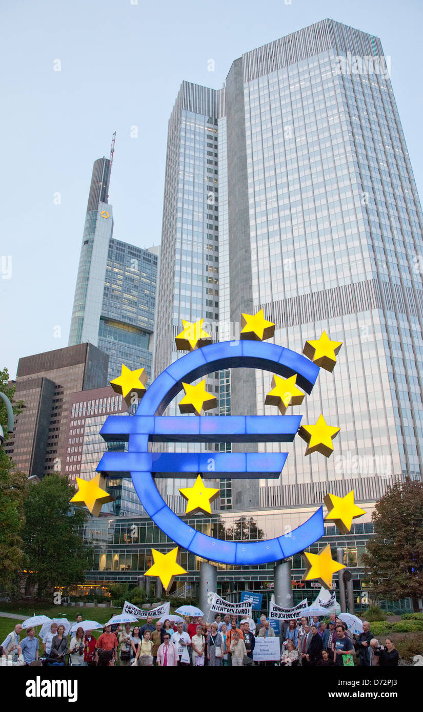 Frankfurt, Germany, a demonstration in front of the Euro sculpture at Euro Tower Stock Photo