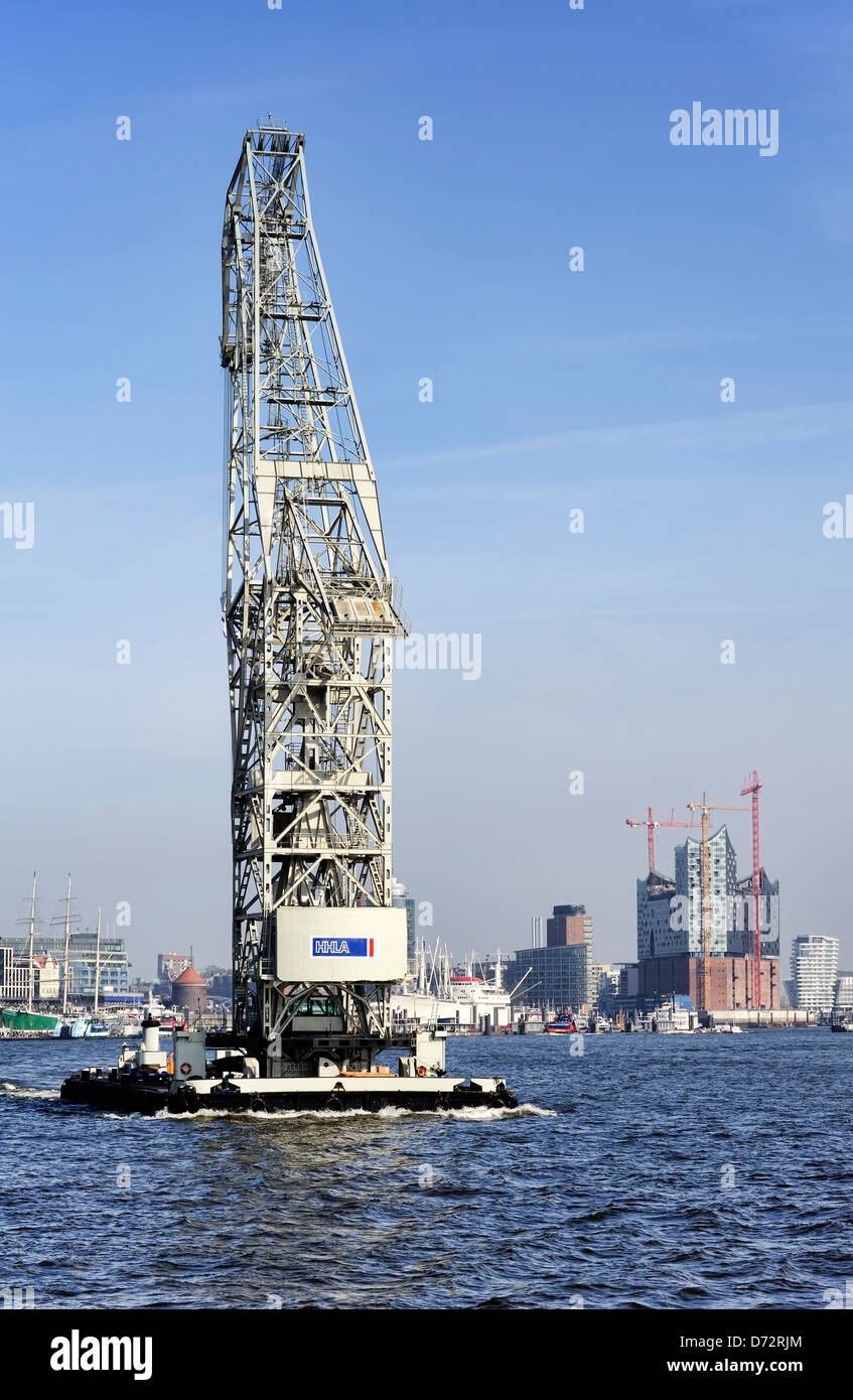 Swimming crane on the Elbe, in the background the Elbphilharmonie located under construction in Hamburg, Germany, Europe Stock Photo