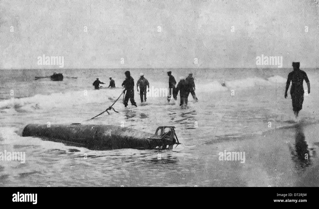A Dangerous kind of fish - Big torpedo found floating off the coast of Rhode Island, near Westerly, and hauled safely up on the shore. It is supposed to have been lost from a United States vessel during torpedo boat practice some time ago. 1912 Stock Photo