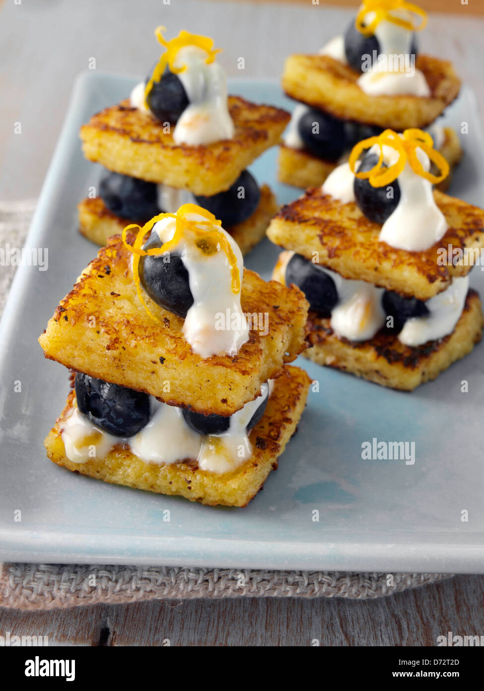 Toasted brioche creamy blueberry stuffing canape hires stock
