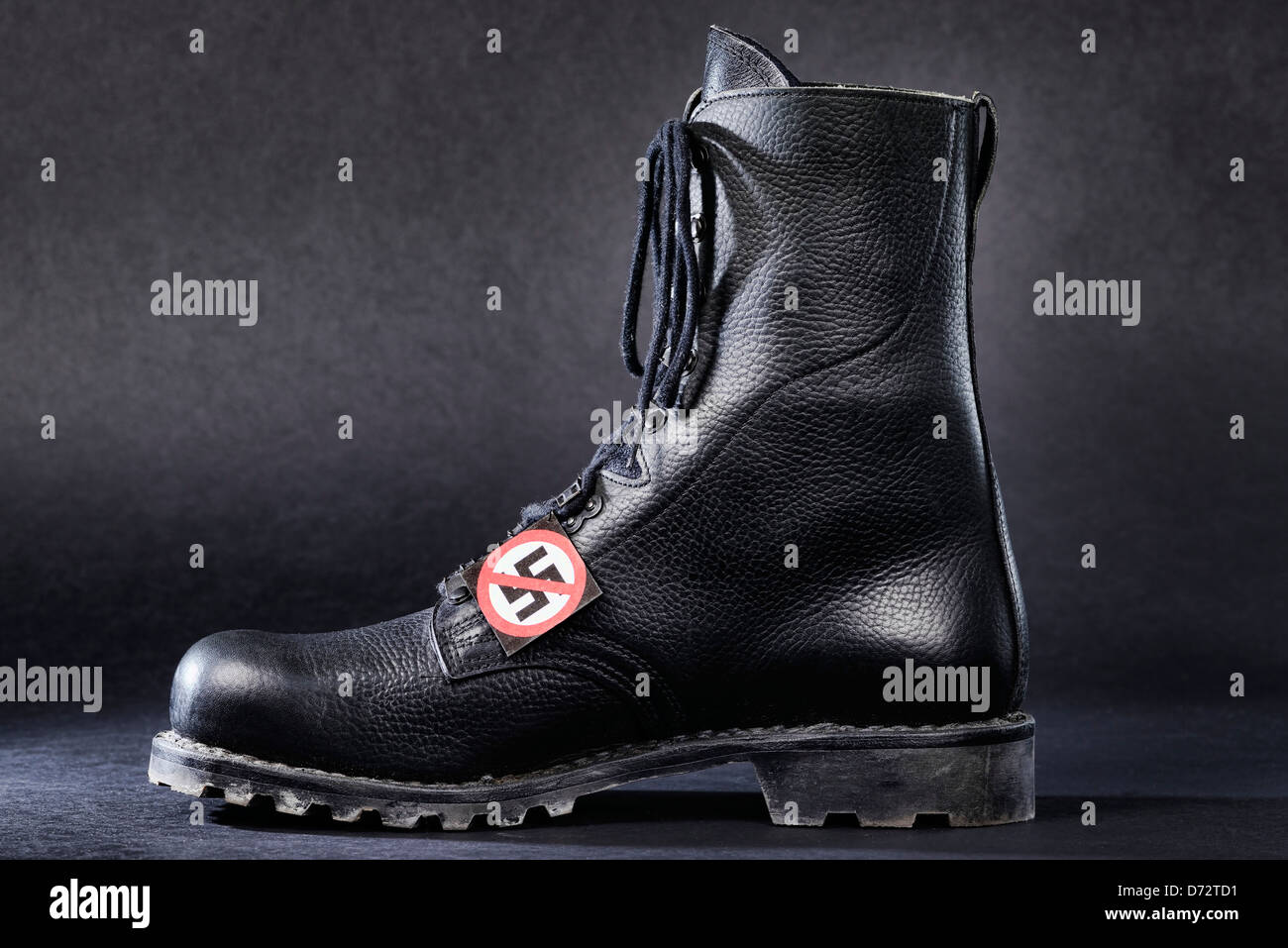 Jumper's boot with crossed out swastika, symbolic photo ban procedure NPD  Stock Photo - Alamy