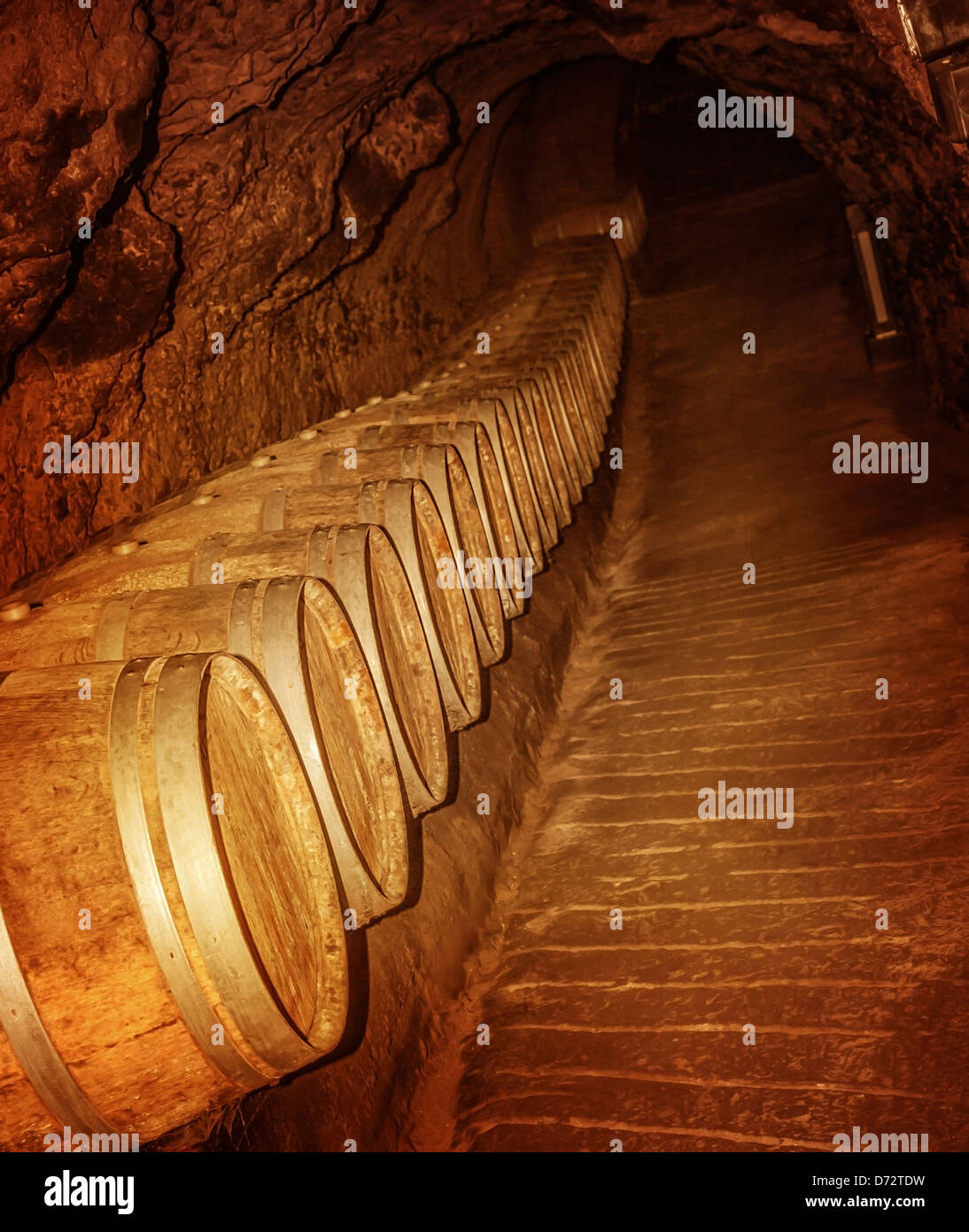 Old winery cave, wooden barrel with luxury wine in the basement, tasty
