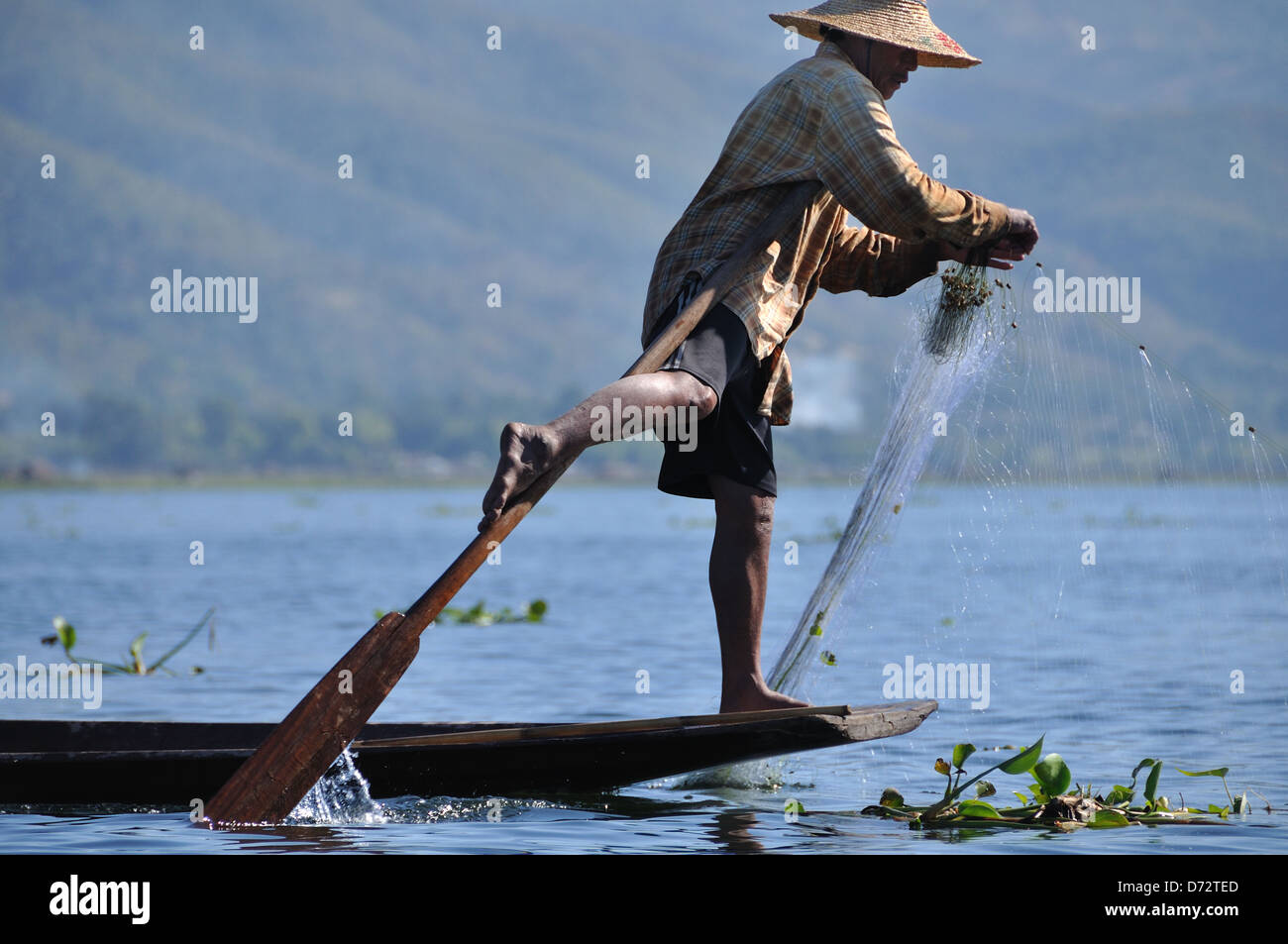Inle Lake Fisherman Using Unique Leg-Rowing Technique Stock Photo