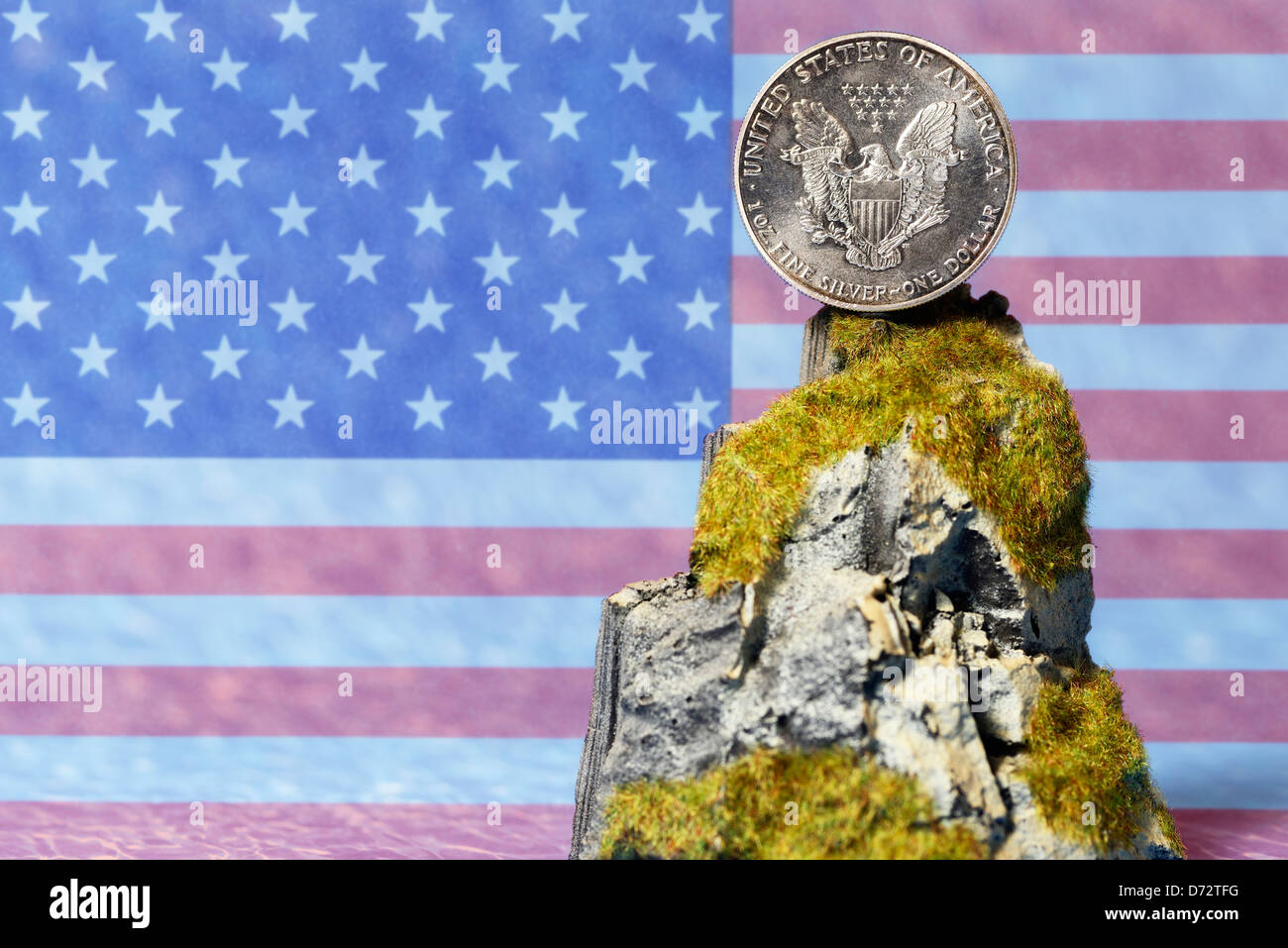 US-silver dollar on cliff, tax inspector's cliff Stock Photo