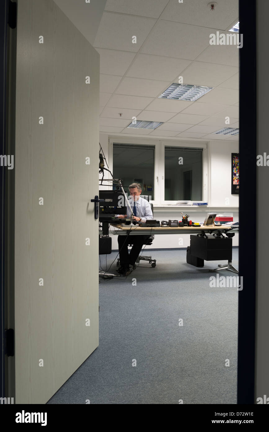 Businessman working late in his office Stock Photo