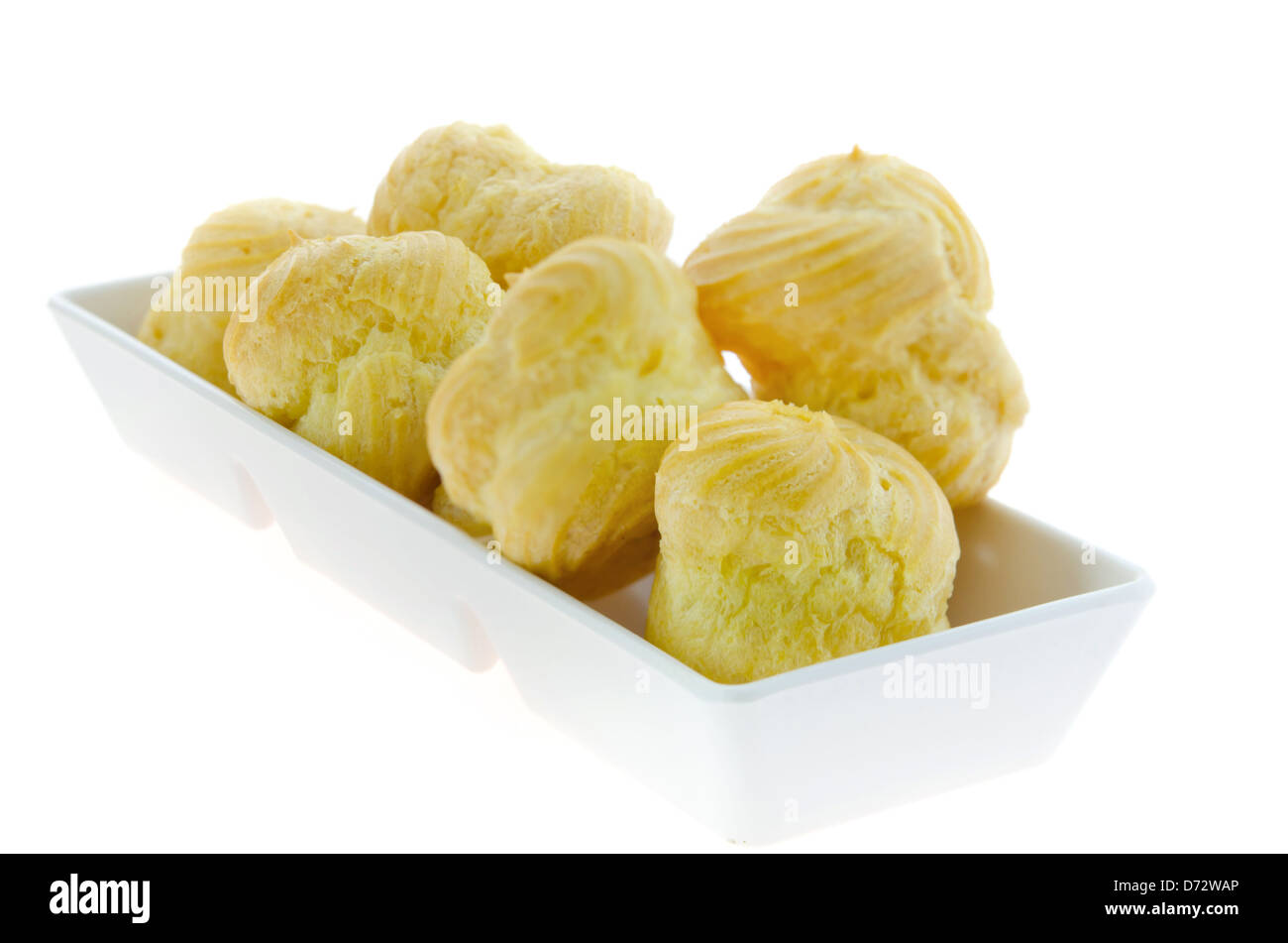 Choux pastry in white bowl over white background Stock Photo - Alamy