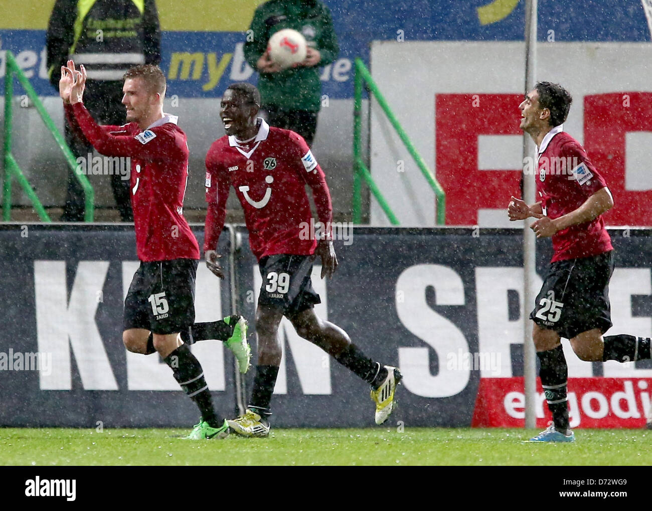 Hannover's Andre Hoffmann (L) gestures with Mame Diouf (C) and Mohammed Abdellaoue after he scores 1:2 during the match SpVgg Greuther Fuerth - Hannover 96 in the Trolli Arena in Fuerth, Germany, 26 April 2013. Photo: Daniel Karmann Stock Photo