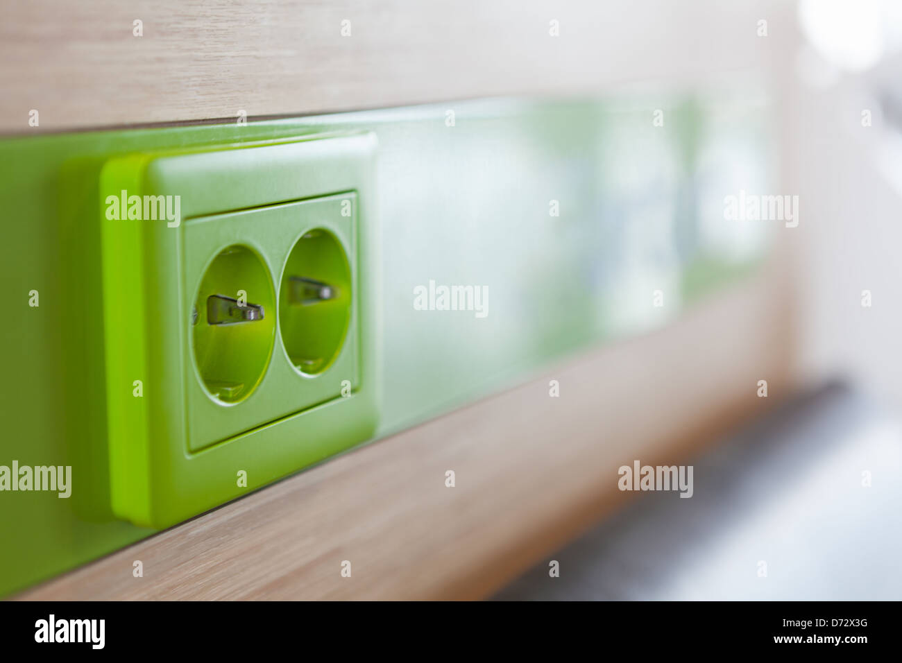 Green appliance receptacle for charging. Close up Stock Photo