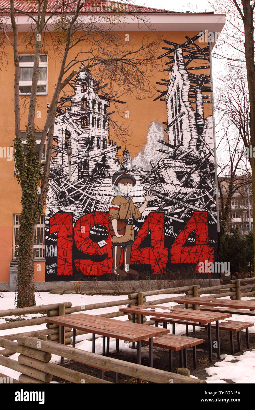 Warsaw Poland art mural commemorating the 1944 Warsaw Uprising and the role children played as messengers on side of a school Stock Photo