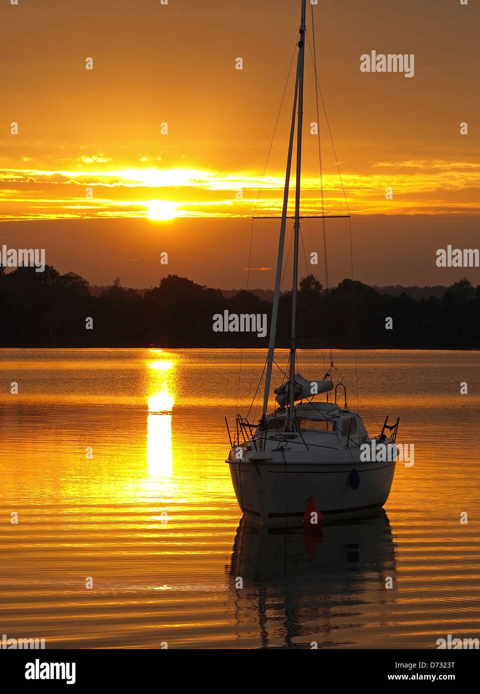 sailboat on the sunset lake Stock Photo - Alamy