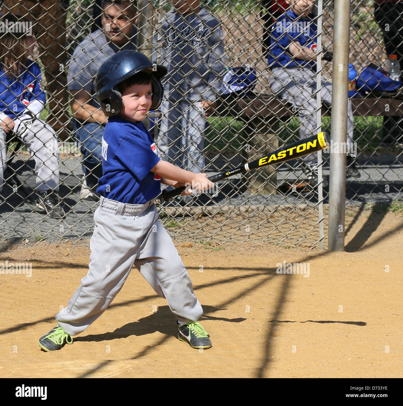 A little league tee ball tball baseball batter. A swing and a hit