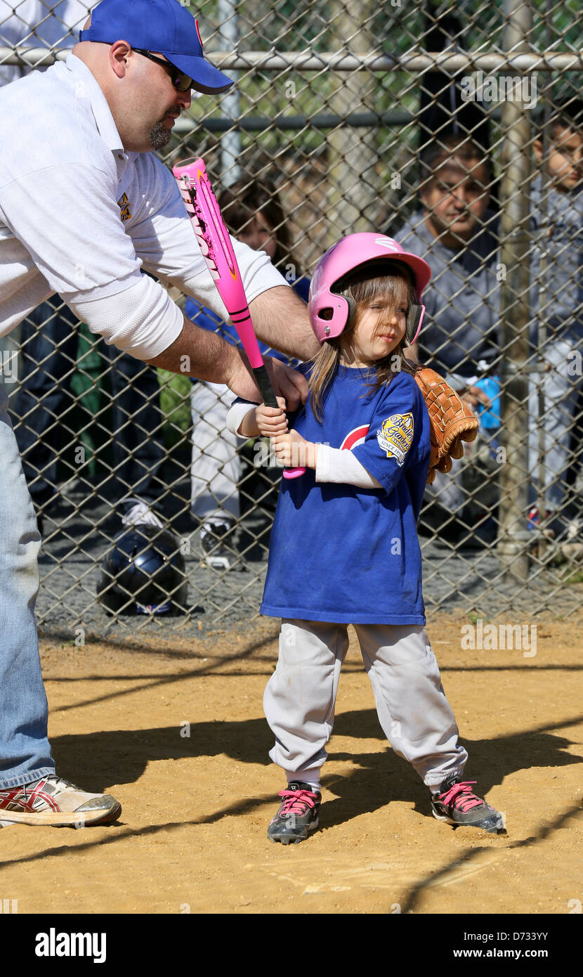 A little girl baseball tee ball tball player getting batting instruction Stock Photo Alamy