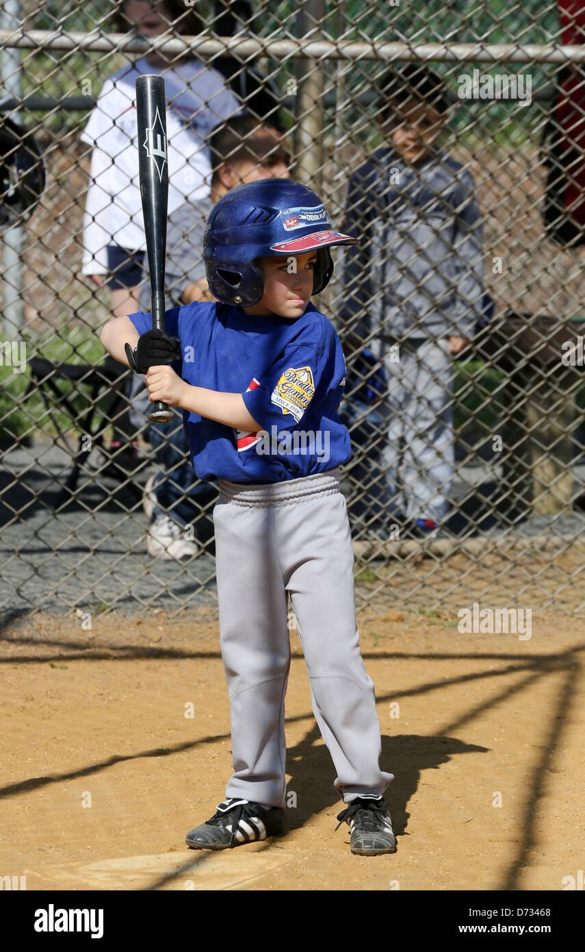 A little boy batting in tee ball t ball baseball Stock Photo Alamy
