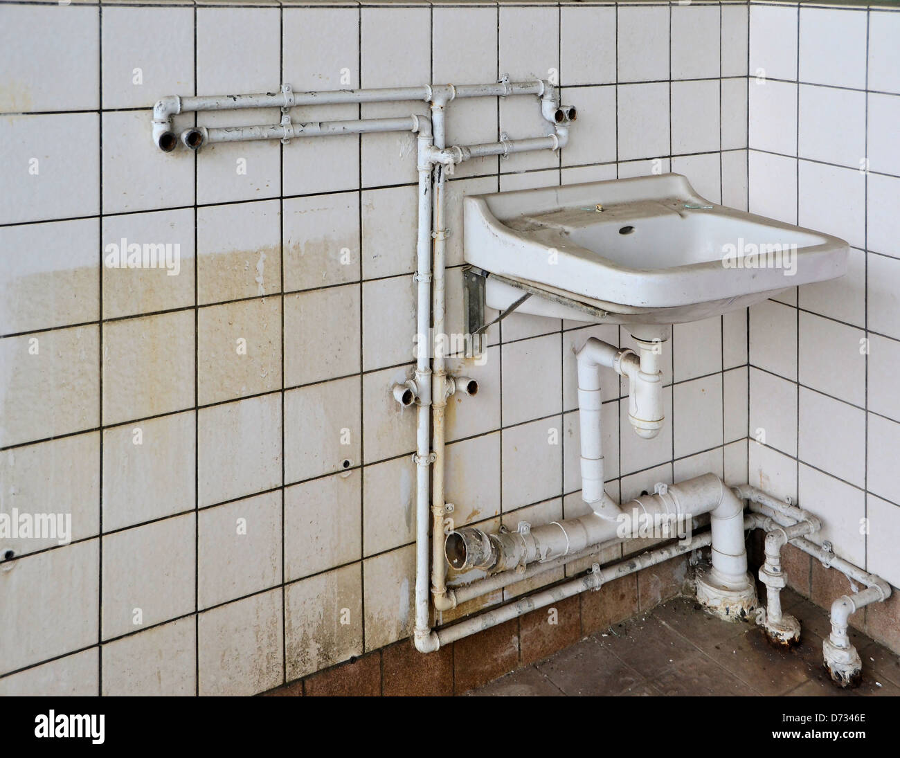 an old sink in a disused factory Stock Photo