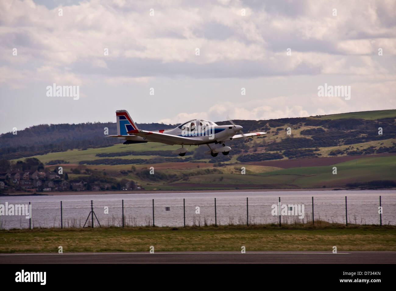 Tayside Aviation Grob G115 Tutor T.1 / Heron G-BVHG aircraft taking off from Dundee Airport during a training course,UK Stock Photo