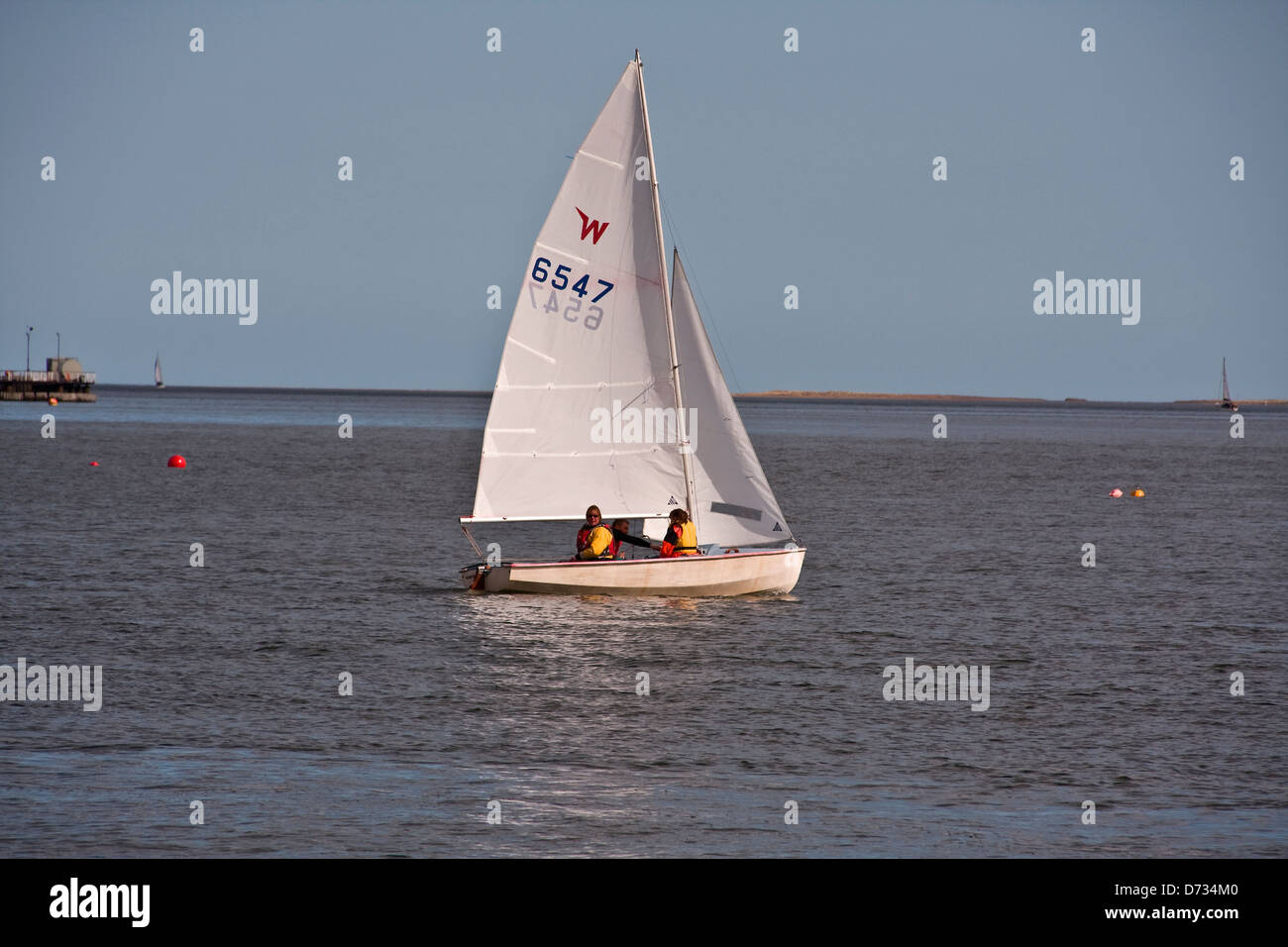 A Yacht from the Royal Tay Yacht Club sailing out of Broughty Ferry Bay on a sunny day during a training session near Dundee,UK Stock Photo
