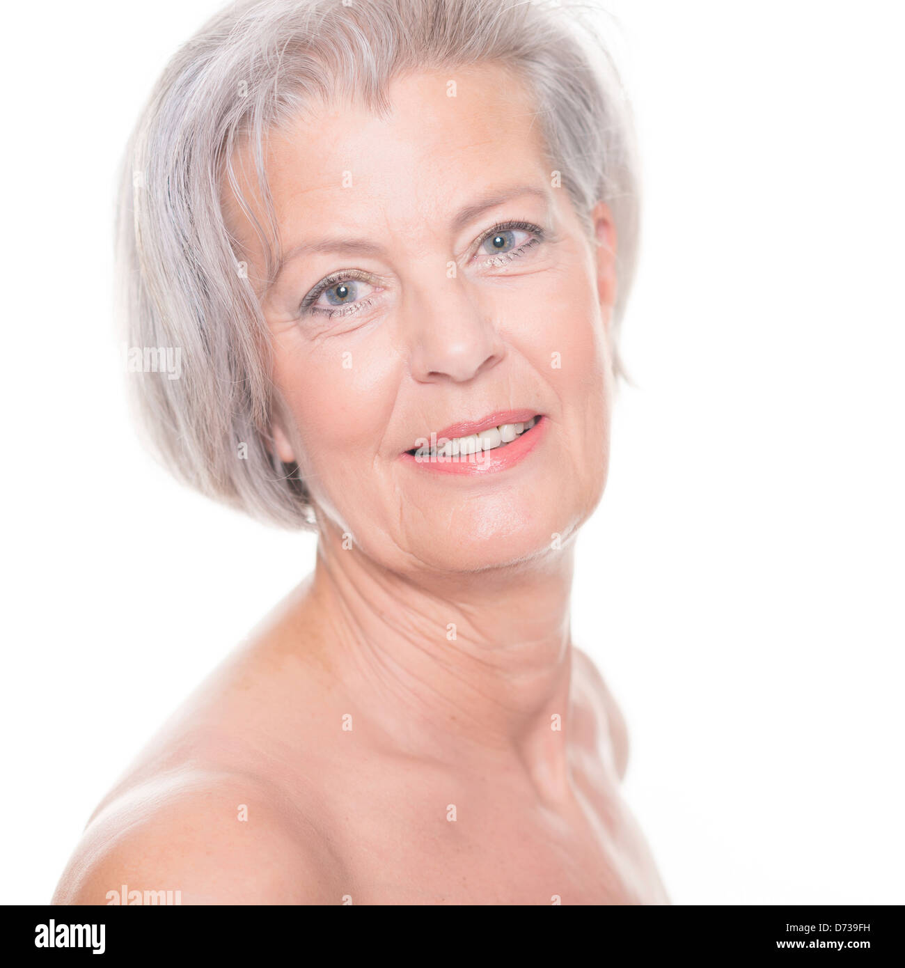Portrait from a senior woman in front of white background Stock Photo