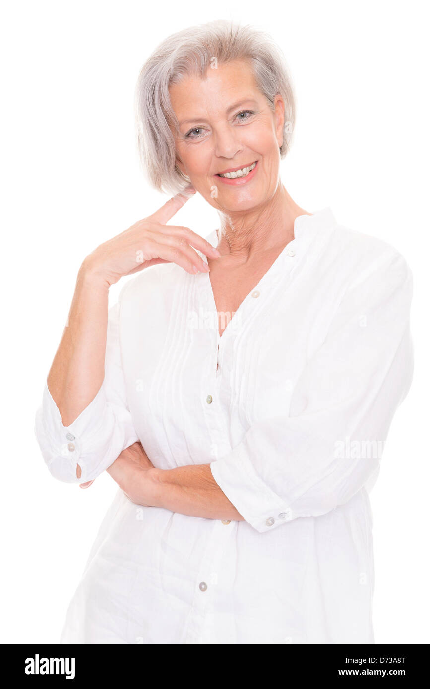 Smiling senior woman in front of white background Stock Photo - Alamy